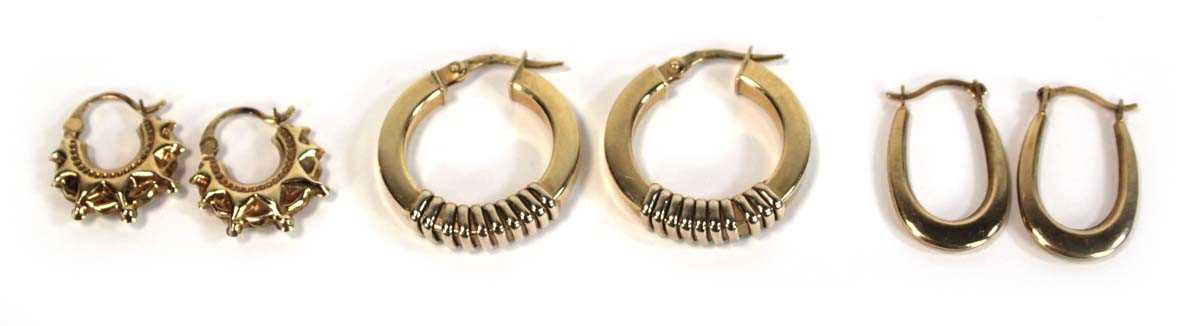 Lot 658 - Three pairs of 9ct yellow gold ear hoops, max...