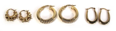 Lot 658 - Three pairs of 9ct yellow gold ear hoops, max...