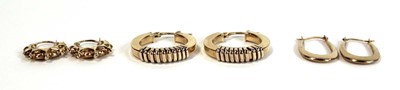 Lot 658 - Three pairs of 9ct yellow gold ear hoops, max...