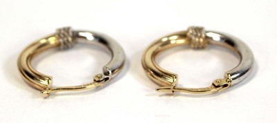 Lot 659 - A pair of 14ct two-colour gold ear hoops, l. 2....