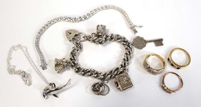 Lot 663 - A silver charm bracelet, 56 gms, a silver...