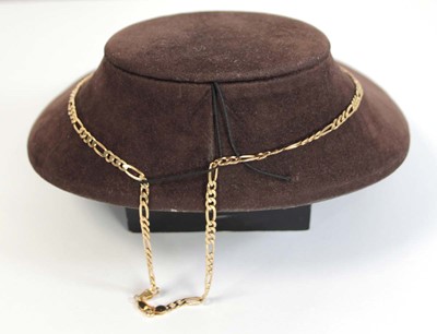 Lot 669 - A 9ct yellow gold figaro link necklace with...