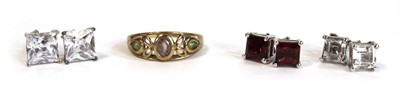 Lot 670 - A 9ct yellow gold ring set pale amethyst and...