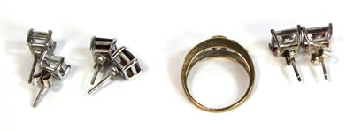 Lot 670 - A 9ct yellow gold ring set pale amethyst and...