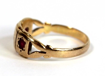 Lot 673 - An 18ct yellow gold pinky ring set two small...