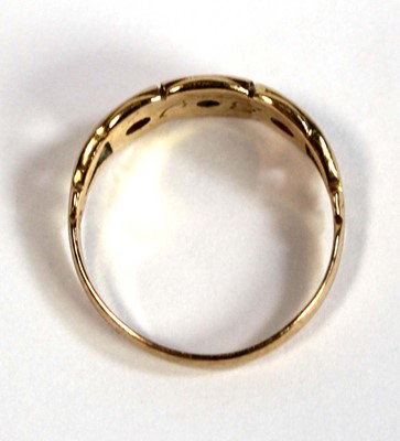 Lot 673 - An 18ct yellow gold pinky ring set two small...