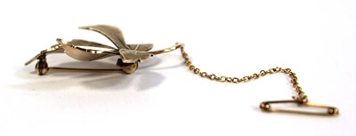 Lot 675 - A 9ct yellow gold brooch in the form of a...