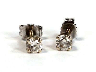 Lot 680 - A pair of yellow metal screw back ear studs,...