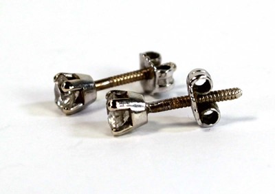 Lot 680 - A pair of yellow metal screw back ear studs,...