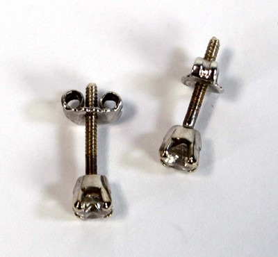 Lot 680 - A pair of yellow metal screw back ear studs,...