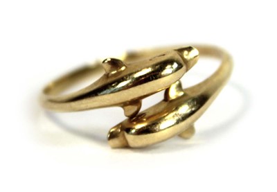 Lot 684 - A 15ct yellow gold crossover ring modelled as...
