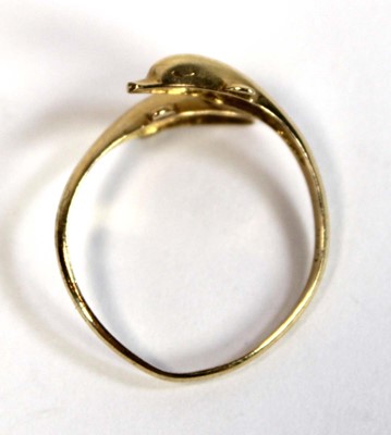 Lot 684 - A 15ct yellow gold crossover ring modelled as...