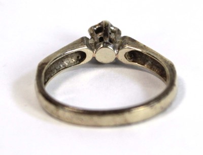 Lot 685 - A 9ct white gold ring set small diamond in an...