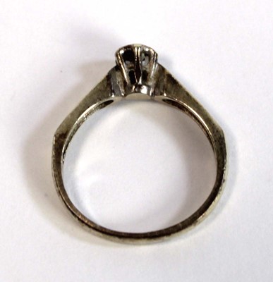 Lot 685 - A 9ct white gold ring set small diamond in an...