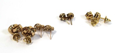 Lot 689 - A pair of 18ct yellow gold ear studs, each set...