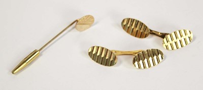 Lot 691 - A pair of 9ct yellow gold oval cufflinks and a...