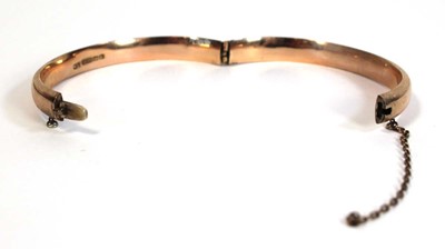 Lot 693 - A 9ct rose gold hinged bracelet, Birmingham...
