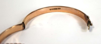 Lot 693 - A 9ct rose gold hinged bracelet, Birmingham...
