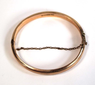 Lot 693 - A 9ct rose gold hinged bracelet, Birmingham...
