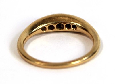 Lot 695 - An 18ct yellow gold ring set five small...