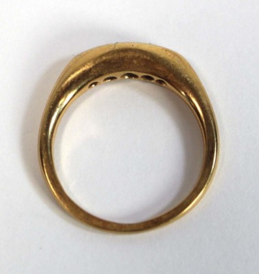 Lot 695 - An 18ct yellow gold ring set five small...