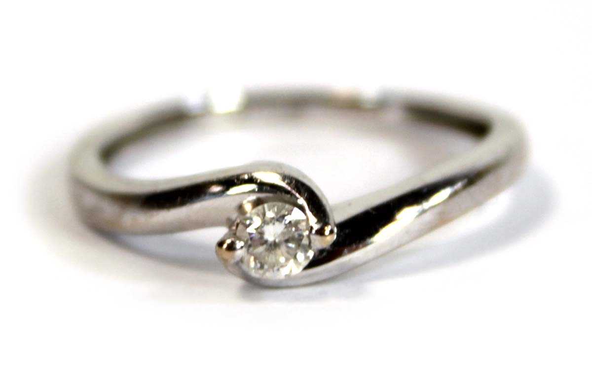Lot 696 - An 18ct white gold crossover ring set small...