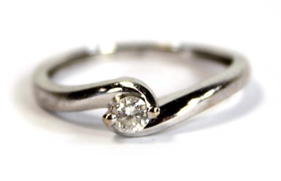 Lot 696 - An 18ct white gold crossover ring set small...