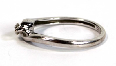 Lot 696 - An 18ct white gold crossover ring set small...