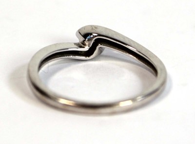 Lot 696 - An 18ct white gold crossover ring set small...
