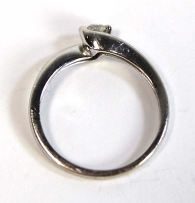 Lot 696 - An 18ct white gold crossover ring set small...