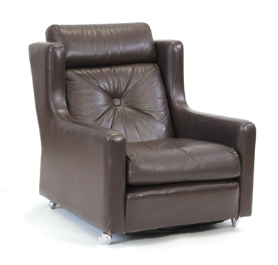 Lot 142 - A 1970's style Danish lounge chair with brown...