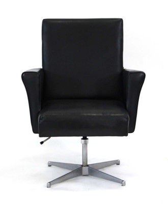 Lot 141 - A 1960's desk chair upholstered in black on an...