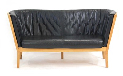 Lot 256 - A Danish two-seater sofa or love seat by...