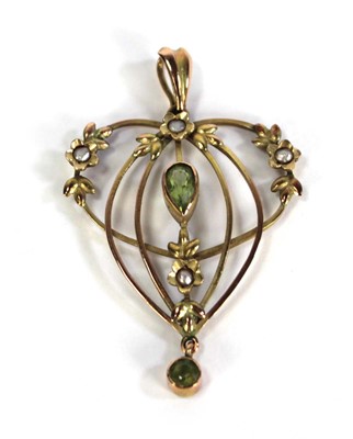 Lot 721 - An Edwardian yellow metal openwork pendant set...