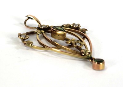 Lot 721 - An Edwardian yellow metal openwork pendant set...