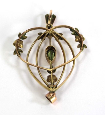 Lot 721 - An Edwardian yellow metal openwork pendant set...