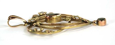 Lot 721 - An Edwardian yellow metal openwork pendant set...