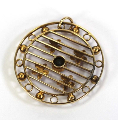Lot 722 - An Edwardian yellow metal openwork pendant of...