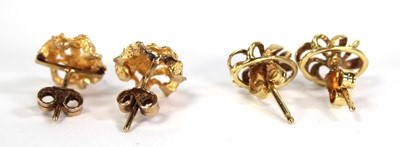 Lot 723 - A pair of 9ct yellow gold ear studs of...