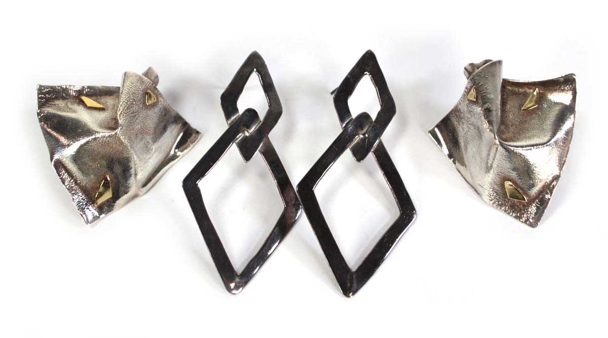 Lot 724 - A pair of silver and parcel gilt ear studs of...