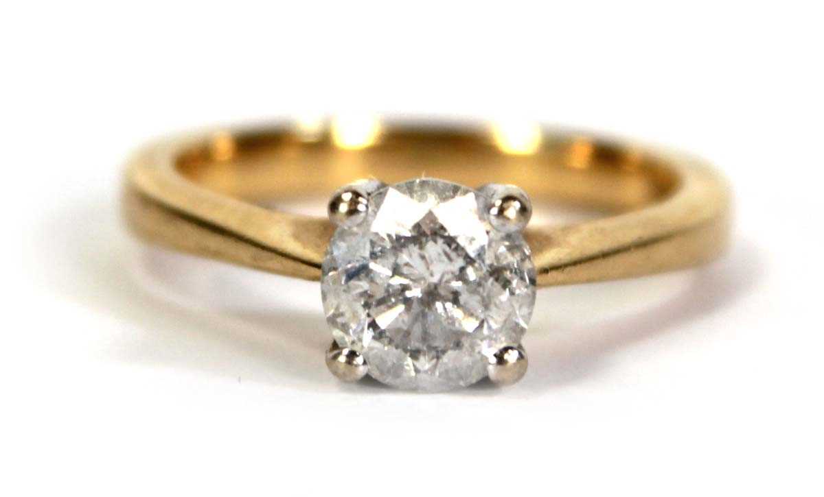 Lot 729 - An 18ct yellow gold yellow gold ring set...