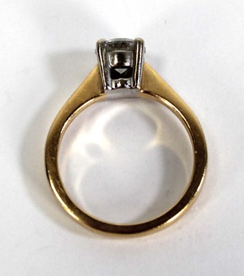 Lot 729 - An 18ct yellow gold yellow gold ring set...