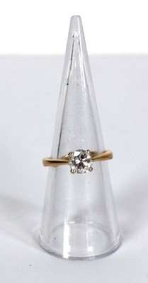 Lot 729 - An 18ct yellow gold yellow gold ring set...