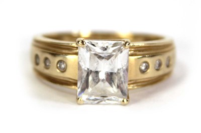 Lot 731 - A 14ct yellow gold ring set princess cut cubic...