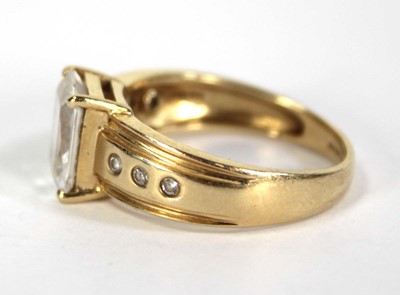 Lot 731 - A 14ct yellow gold ring set princess cut cubic...