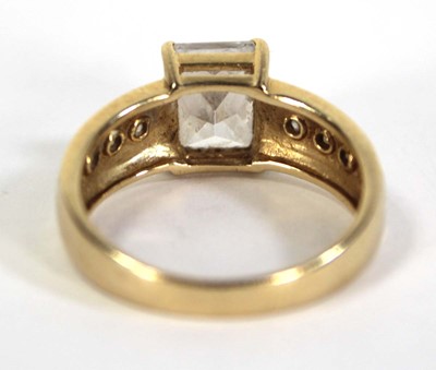 Lot 731 - A 14ct yellow gold ring set princess cut cubic...