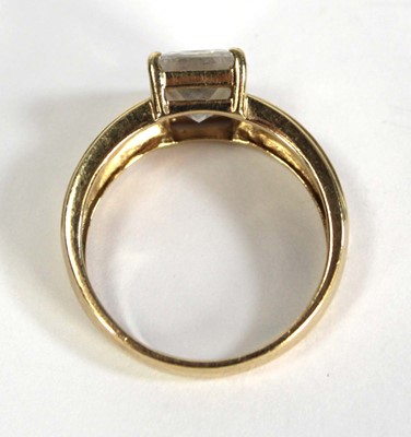 Lot 731 - A 14ct yellow gold ring set princess cut cubic...