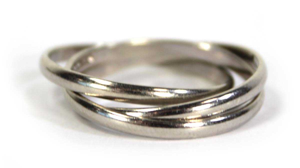 Lot 732 - A 9ct white gold three band ring, ring size N,...