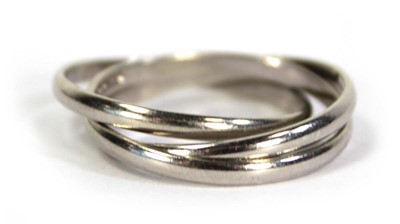 Lot 732 - A 9ct white gold three band ring, ring size N,...
