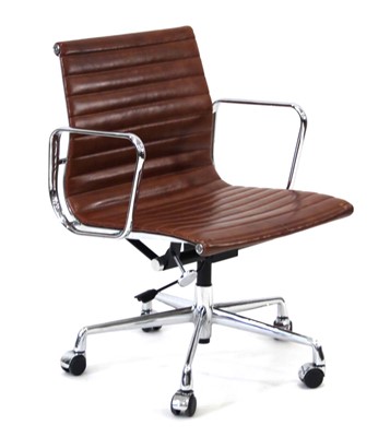 Lot 278 - A desk chair in the style of Charles & Ray...